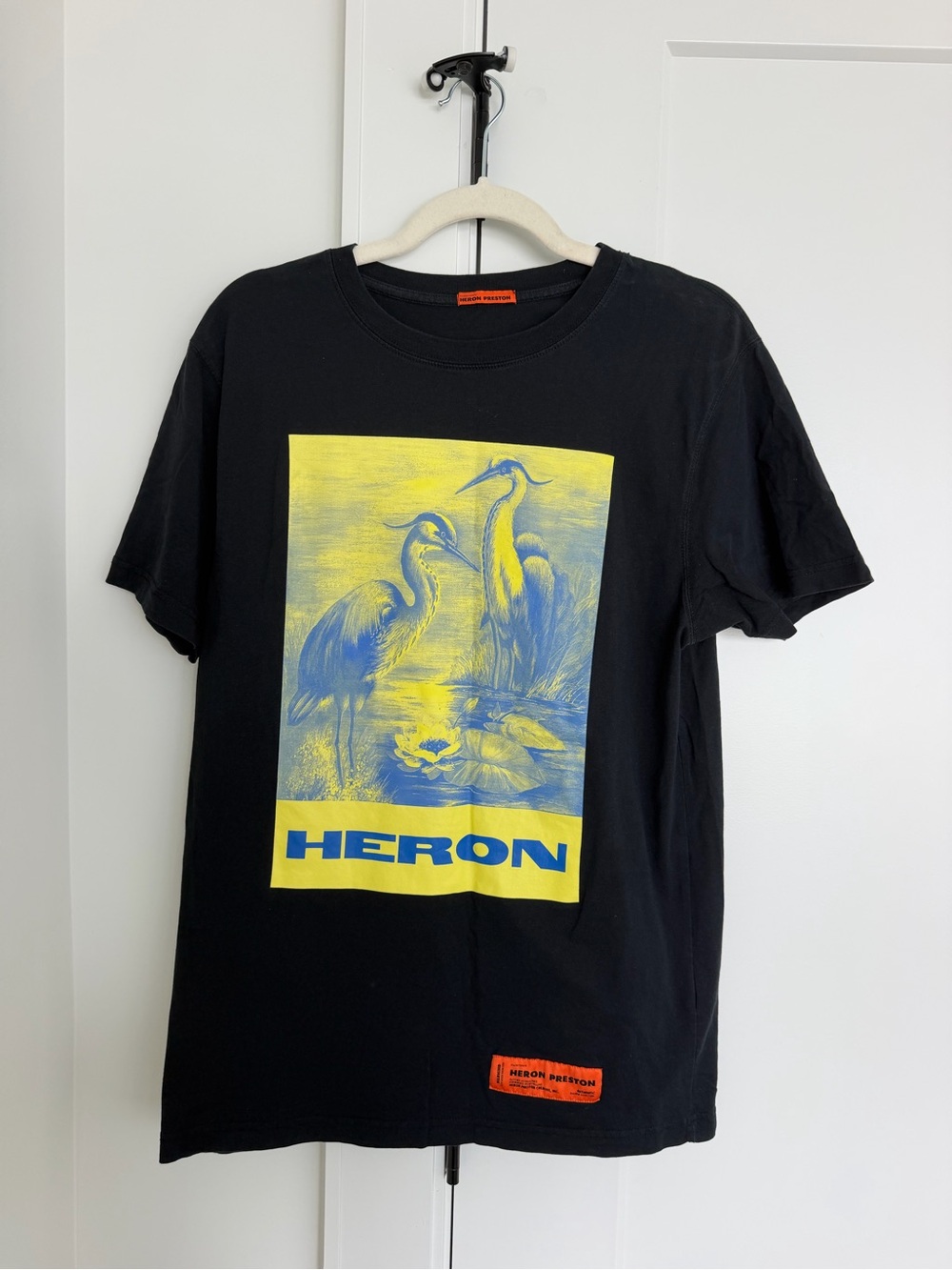 Heron Preston Black Tee with Yellow and Blue Heron Graphic